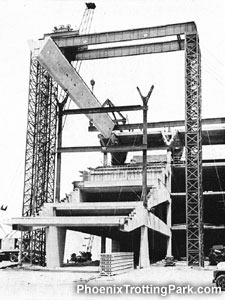 Gantry crane lowering roof supports into place